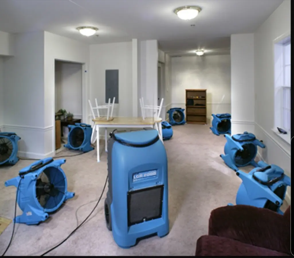 Air movers and dehumidifier setup for Water Damage Restoration in Rindge